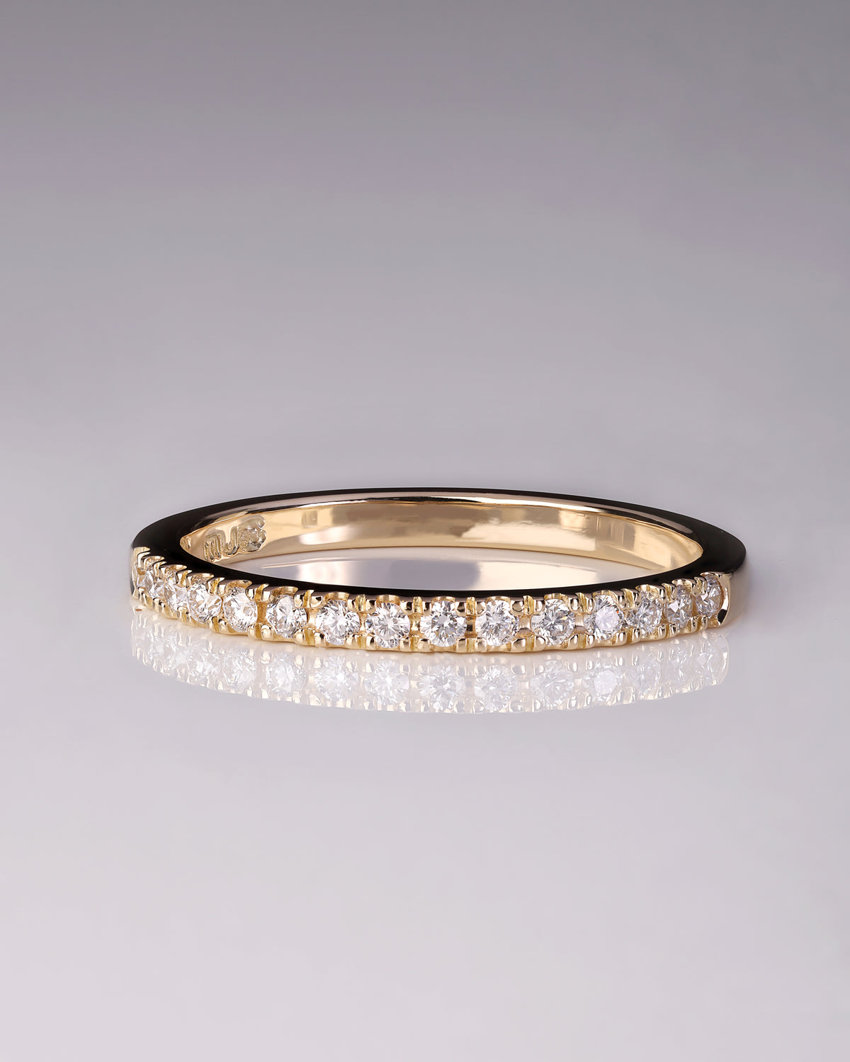 Handcrafted 18ct Yellow Gold band half set with Round Brilliant Cut Diamonds.