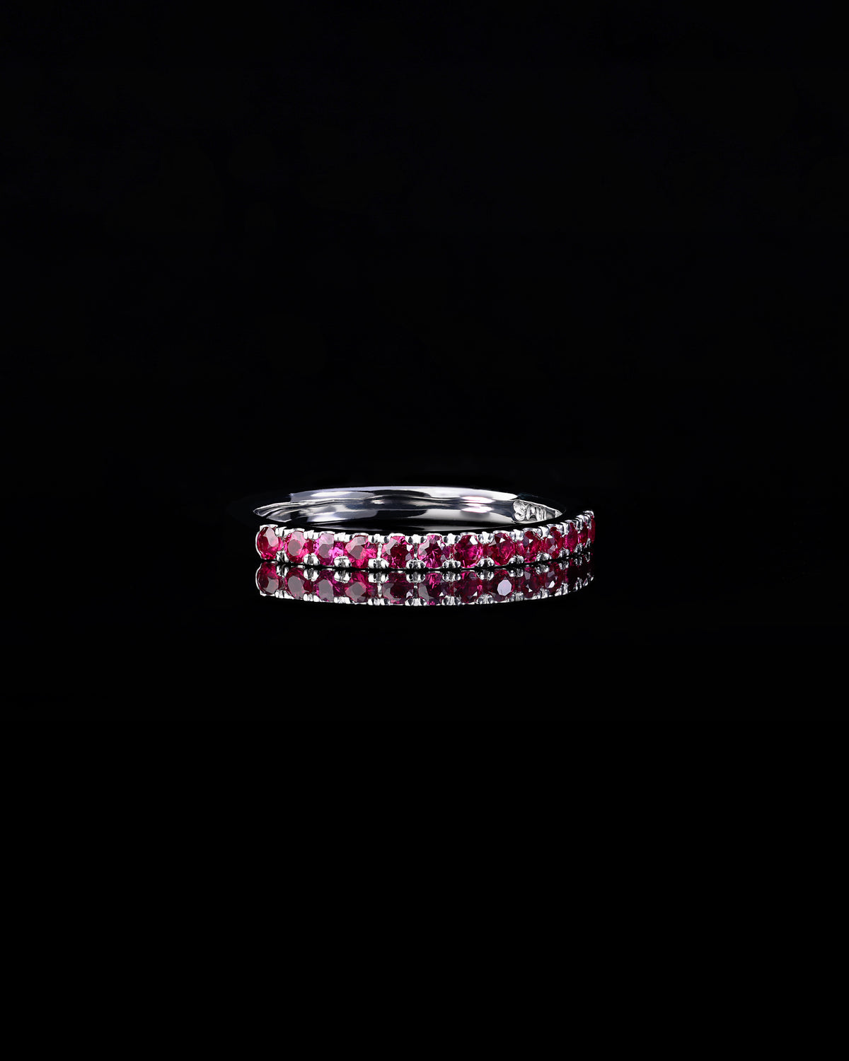 Handcrafted 18ct Gold Band half set with Rubies.