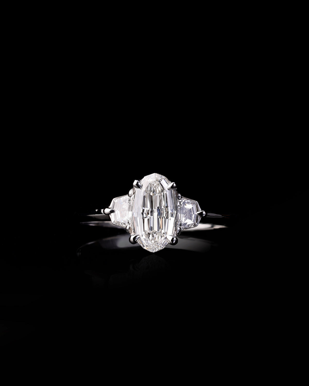 Unique .70ct Step Cut Oval Diamond Trilogy Ring in Platinum