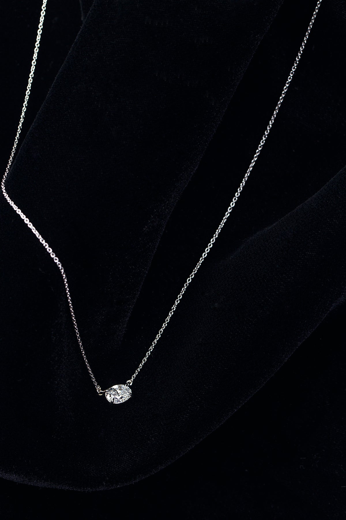 Platinum Oval Diamond pendent in an East-West setting