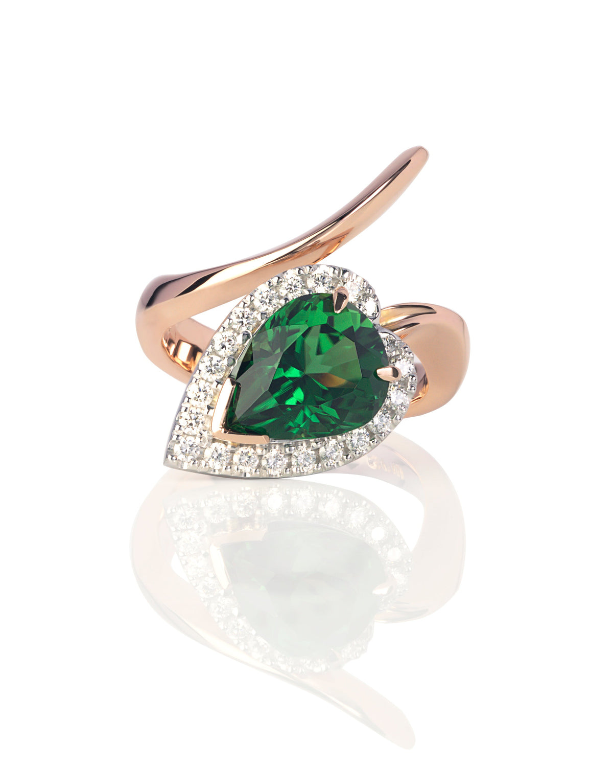 A bespoke ring featuring a bright green pear cut Chrome Tourmaline with round brilliant cut diamonds, set in 18ct white and rose gold with a sculptured 'Serpent' design.