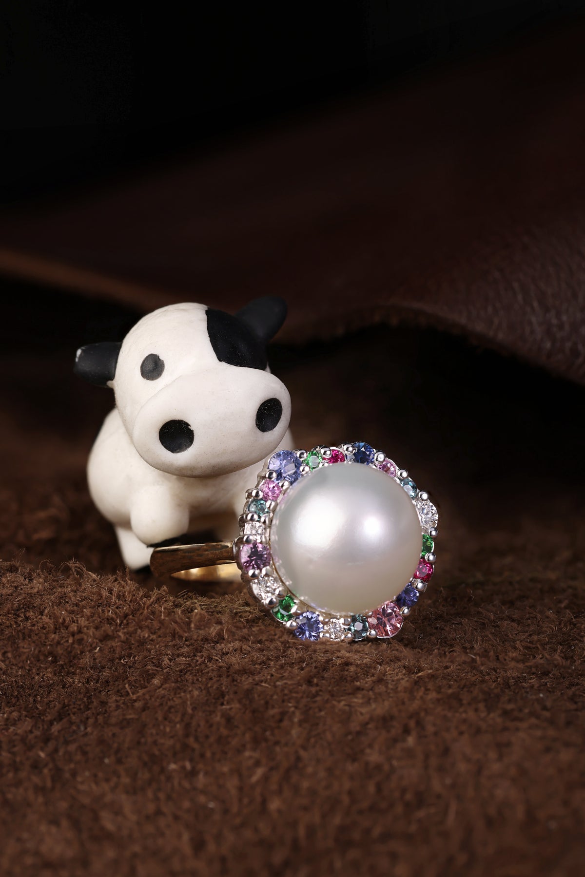 Australian South Sea Pearl surrounded by a medley of Precious Gemstones dress ring.