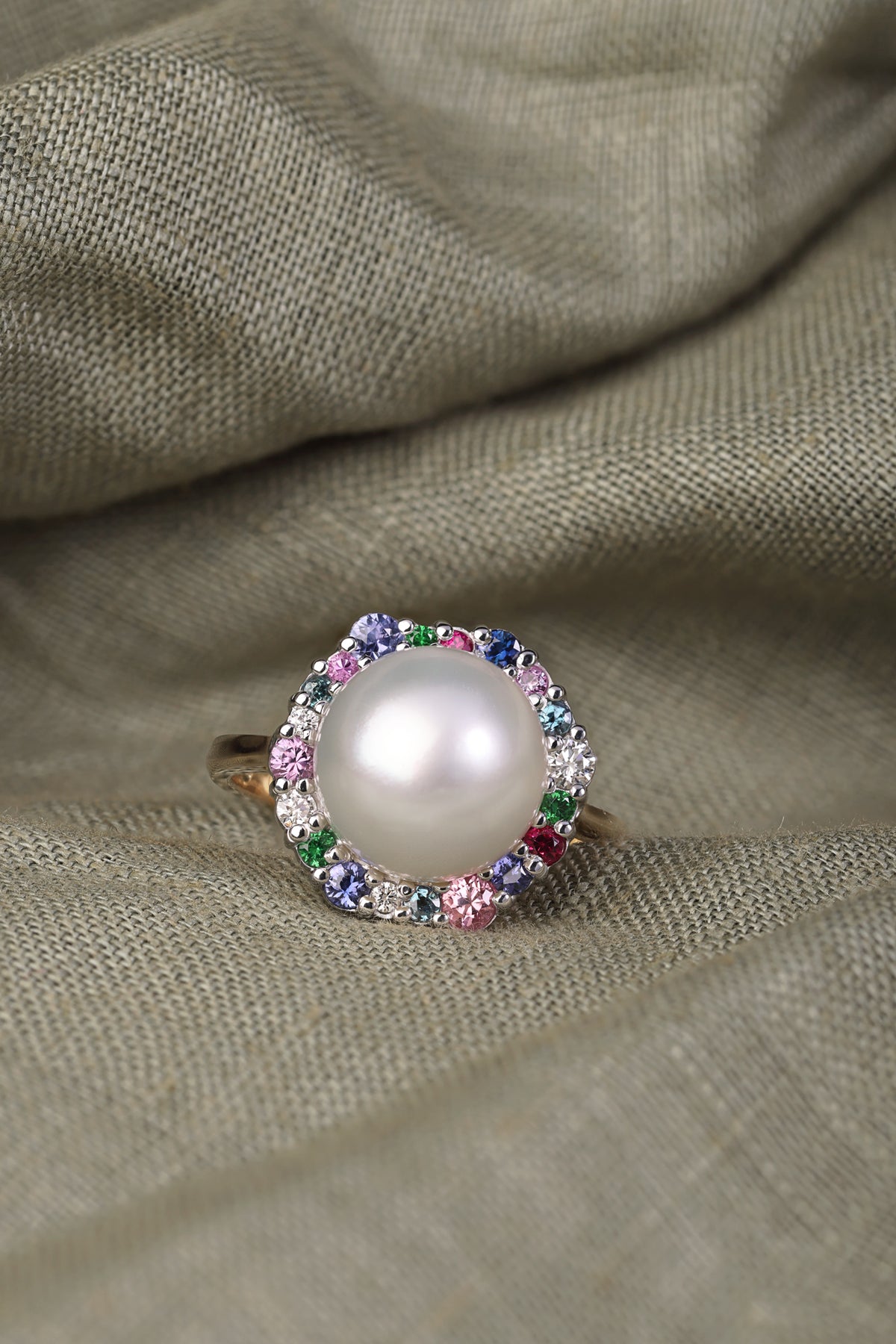 Australian South Sea Pearl surrounded by a medley of Precious Gemstones dress ring.