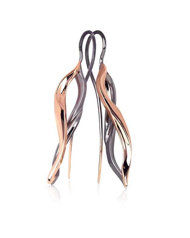 A pair of flame-shaped earrings crafted in rose gold with black rhodium finish, with diamond set version featuring multiple small round cut diamonds.